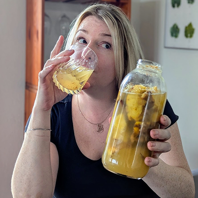 Your workshop host, Lauren, holding a jar of tepache, a Mexican fermented pineapple drink
