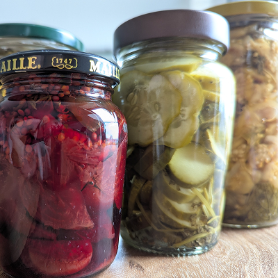 A shelf filled with various pickled vegetables